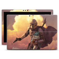 Les nuages ​​du coucher du soleil Mandalorien et Grogu